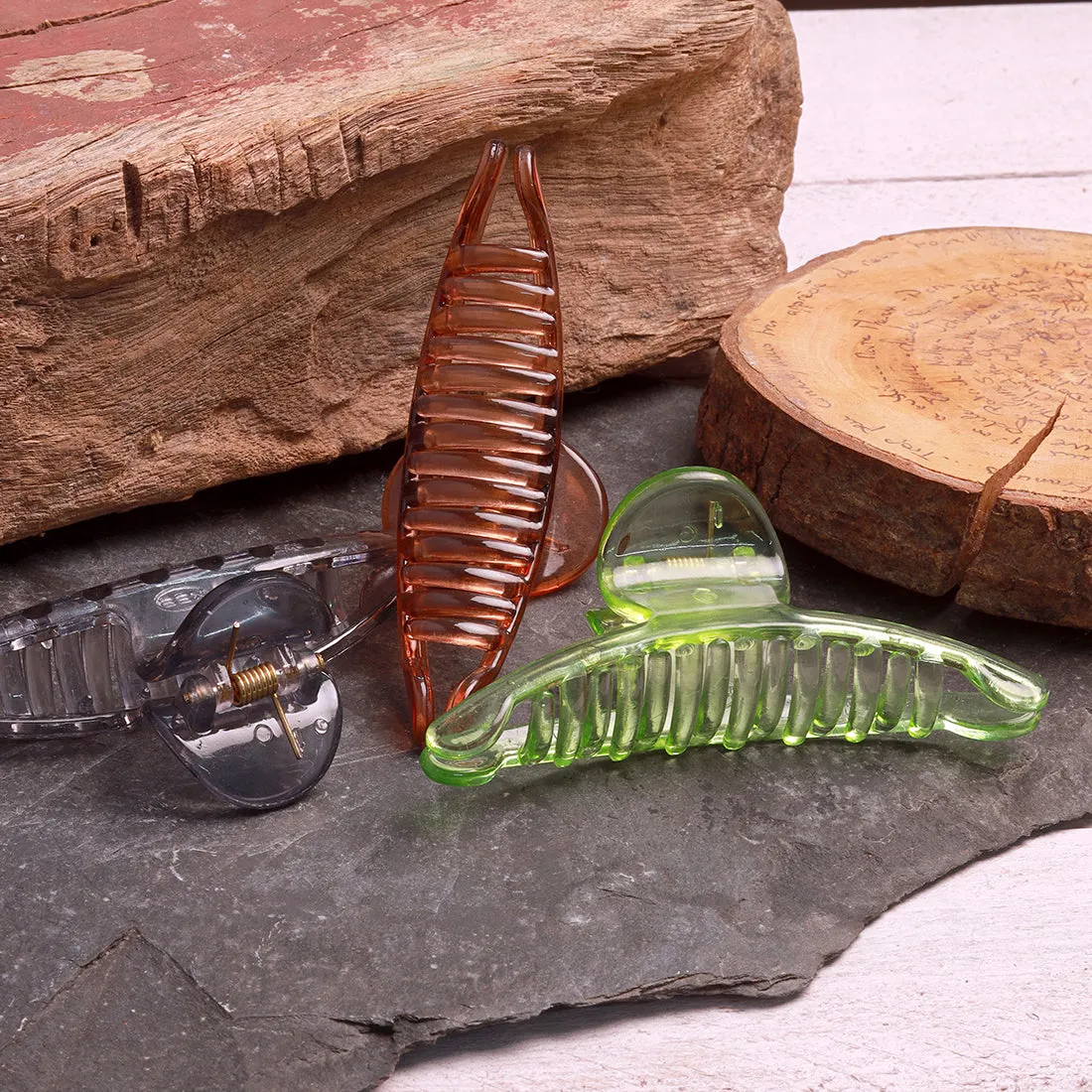 Chic Set Of Three Hair Clutches In Transparent, Tan, Green, And Grey Shades.
